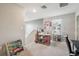 Upstairs living area with multiple desks, an office space, and comfortable seating, a versatile layout at 10013 Caraway Spice Ave, Riverview, FL 33578