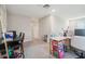 Upstairs living area with multiple desks, an office space, and comfortable seating, a versatile layout at 10013 Caraway Spice Ave, Riverview, FL 33578
