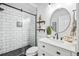Remodeled bathroom featuring a tiled shower with glass enclosure and a modern vanity at 1008 W Braddock St, Tampa, FL 33603