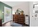 Dresser in main bedroom with views of renovated bathroom and backyard at 1008 W Braddock St, Tampa, FL 33603