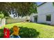 Wide shot of a spacious backyard with healthy grass, a privacy fence, and play equipment at 10148 Rose Petal Pl, Riverview, FL 33578