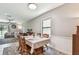 Open-concept dining area with natural light and seamless flow into the adjacent living space at 10148 Rose Petal Pl, Riverview, FL 33578