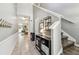 Entryway featuring neutral walls, tile flooring, staircase and decor elements to create a welcoming ambiance at 10148 Rose Petal Pl, Riverview, FL 33578