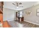Home Office with ceiling fan, map, and shelves at 10148 Rose Petal Pl, Riverview, FL 33578
