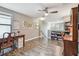 Home office area with ceiling fan and shelves on the upper level at 10148 Rose Petal Pl, Riverview, FL 33578