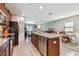 Charming kitchen featuring granite countertops, wood cabinets, and stainless steel appliances at 10148 Rose Petal Pl, Riverview, FL 33578