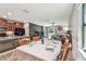 Open floor plan seamlessly connecting the kitchen, dining area and living room for easy flow and entertaining at 10148 Rose Petal Pl, Riverview, FL 33578