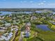 Desirable waterfront home in a picturesque community with scenic lake views and lush surroundings from above at 1015 S Pointe Alexis Dr, Tarpon Springs, FL 34689