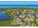 Lovely waterfront property boasts access to a serene lake, nestled in a vibrant community from an aerial perspective at 1015 S Pointe Alexis Dr, Tarpon Springs, FL 34689
