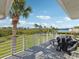Enjoy picturesque lake views from this spacious back deck, complete with grill at 1015 S Pointe Alexis Dr, Tarpon Springs, FL 34689