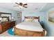Bedroom featuring wood furniture and a serene coastal vibe at 1015 S Pointe Alexis Dr, Tarpon Springs, FL 34689