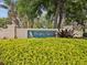 Entrance sign for the Pointe Alexis deed-restricted community, surrounded by lush greenery at 1015 S Pointe Alexis Dr, Tarpon Springs, FL 34689