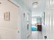 Hallway with hardwood floors and access to living spaces at 1015 S Pointe Alexis Dr, Tarpon Springs, FL 34689