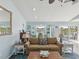 Bright living room with comfortable seating and seamless flow to outdoor space at 1015 S Pointe Alexis Dr, Tarpon Springs, FL 34689