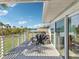 Relaxing patio with a grill perfect for outdoor entertaining and lake view at 1015 S Pointe Alexis Dr, Tarpon Springs, FL 34689