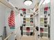 Spacious walk-in closet with custom shelving and ample storage space for organizing clothes and accessories at 1015 S Pointe Alexis Dr, Tarpon Springs, FL 34689
