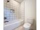 Clean bathroom featuring a tub with tile surround and modern fixtures at 1017 W Charter St, Tampa, FL 33602