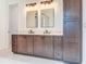 Bathroom vanity featuring double sinks, granite countertops, and plenty of storage at 1017 W Charter St, Tampa, FL 33602