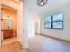 Bright bedroom featuring hardwood floors, modern ceiling fan and large window providing ample natural light at 1017 W Charter St, Tampa, FL 33602