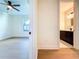 View from the bedroom into a well-appointed bathroom, neutral color palette, and modern lighting fixtures at 1017 W Charter St, Tampa, FL 33602