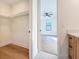 Bright closet interior features built-in shelving and hardwood floors, with views into bedroom area at 1017 W Charter St, Tampa, FL 33602