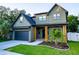 Beautiful two-story home featuring a modern color scheme and a well-kept lawn and front garden at 1017 W Charter St, Tampa, FL 33602