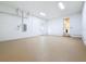 Well-lit, clean garage with a sealed floor and a pedestrian door at 1017 W Charter St, Tampa, FL 33602
