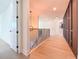 Hallway featuring wood flooring and a staircase with black metal railings at 1017 W Charter St, Tampa, FL 33602