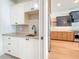 Bright kitchen featuring stylish white cabinetry, modern countertops, and sleek black hardware at 1017 W Charter St, Tampa, FL 33602