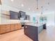 Bright kitchen with stainless steel appliances, modern cabinets and an island with pendant lighting at 1017 W Charter St, Tampa, FL 33602