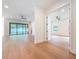 Bright and airy open living space with hardwood floors and large windows overlooking the backyard at 1017 W Charter St, Tampa, FL 33602