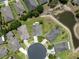 Aerial view looking straight down at a cul-de-sac with a pond in the background at 11220 Godwit Ct, New Port Richey, FL 34654