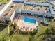 An aerial view shows a sparkling pool and relaxing lounge area in the amenity center at 11220 Godwit Ct, New Port Richey, FL 34654