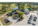 Aerial view of a clubhouse near golf course with parking at 11220 Godwit Ct, New Port Richey, FL 34654
