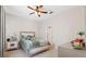 Comfortable bedroom with a ceiling fan and neutral color palette at 11220 Godwit Ct, New Port Richey, FL 34654
