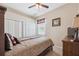 Comfortable bedroom with a ceiling fan, closet, neutral walls and a window with blinds at 11220 Godwit Ct, New Port Richey, FL 34654