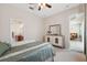Inviting bedroom with stylish furniture and a view to the kitchen at 11220 Godwit Ct, New Port Richey, FL 34654