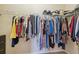 Walk-in closet with plenty of storage space for clothes and accessories at 11220 Godwit Ct, New Port Richey, FL 34654
