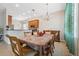 Bright dining room featuring a chandelier and large window, perfect for gatherings and Gathering meals at 11220 Godwit Ct, New Port Richey, FL 34654