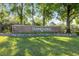 Welcoming SummerTree entrance sign framed by lush landscaping and mature trees at 11220 Godwit Ct, New Port Richey, FL 34654