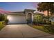 Charming single-story home featuring a well-manicured lawn and a two-car garage in a tranquil neighborhood at 11220 Godwit Ct, New Port Richey, FL 34654