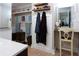 Stylish bathroom showcasing elegant towel rack, robe hooks, and vanity area at 12021 144Th St, Largo, FL 33774