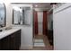 Well-appointed bathroom featuring a modern vanity, walk-in shower, and neutral tile at 12021 144Th St, Largo, FL 33774