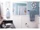 Stylish bathroom featuring double sinks, elegant fixtures, and charming nautical-themed decor at 12021 144Th St, Largo, FL 33774