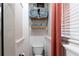 Cozy bathroom featuring stylish shelves with neatly folded towels and decor at 12021 144Th St, Largo, FL 33774