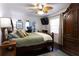 Inviting bedroom featuring hardwood floors and a large wardrobe at 12021 144Th St, Largo, FL 33774