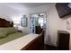 Inviting bedroom featuring hardwood floors and an ensuite office at 12021 144Th St, Largo, FL 33774