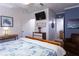 Inviting bedroom with warm wood accents and a cozy sitting area at 12021 144Th St, Largo, FL 33774