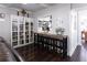 Breakfast bar with seating and built-in shelving at 12021 144Th St, Largo, FL 33774