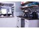 Charming coffee bar with open shelving, butcher block countertop, mini-fridge and beverage accessories at 12021 144Th St, Largo, FL 33774